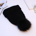 Thick black cable knit beanie with faux fur pom pom and ribbed cuff for winter warmth - Black