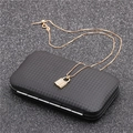 Close-up of gold key lock pendant with zircons on a carbon fiber texture box - Box Chain Micro Pave Lock - Gold