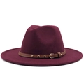 Close-up of burgundy wool fedora with brown leather band and gold rivet detail - Burgundy