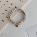 Elastic hair tie woven with white pearls and champagne gold cord with a round metal tag - Pearl White