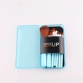 Blue portable 7-piece makeup brush set with brown bristles in a matching storage box - Blue