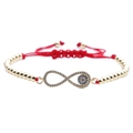 Dettaglio macro del bracciale infinito con occhio blu e intarsio in zircone lucido - Occhio del male / Rosso