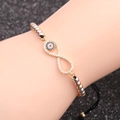 Bracciale infinito malocchio con zirconi e perle tricolori su cordino regolabile - Occhio del male / Nero