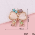 Macro shot of D627 bow-shaped alloy charm with colorful rhinestones and opal hearts - D627 Colorful Bowtie