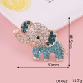 Detail showing an elephant brooch with gold plating, blue rhinestones and size dimensions - Gold Blue Elephant
