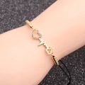 Gold chain bracelet with colorful heart zircon, heartbeat line, and hollow paw charm - Black Rope Bead Chain + Heart Footprint