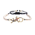 Detailed shot of gold lizard bracelet with multi-color zircon and tricolor metal beads - Gecko Pendant / Tri-color Mixed Bead Chain