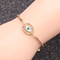 Macro shot of evil eye chain bracelet featuring gold metal and colorful cubic zirconia - Colorful Zircon Evil Eye Style 1