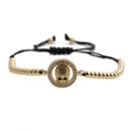 Gouden schedel armband met micro-pave zirkonia en verstelbaar zwart gevlochten touw - Goud