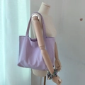 Minimalist Morandi lavender corduroy tote bag for women shown on a wooden mannequin - Creamy Purple