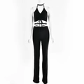 Detail of black halter top with wrap-around waist ties and matching high-waisted trousers - M / Black
