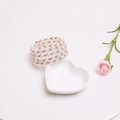 Close-up of multilayer pearl bracelet with rhinestones on a decorative heart tray - Style 2 Gold 3-Layer (B265)