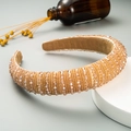Detailed shot of handmade baroque headband with champagne crystal beads on a velvet base - Khaki