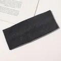 Detailed view of the dark grey ribbed knit headband showing soft elastic texture - Dark Gray