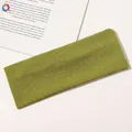 Detail of green ribbed knit yoga headband showing premium moisture-wicking fabric texture - Grass Green