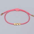 Handmade peach pink braided cord bracelet with three gold metal discs and adjustable closure - Peach Pink