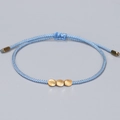 Handmade woven light blue string bracelet with three gold metal beads and pull closure - Light Blue