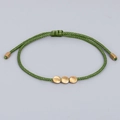 Minimalist hand-woven dark green cord bracelet with three irregular golden copper beads - Dark Green