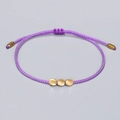 Handcrafted purple braided rope bracelet featuring three irregular golden copper beads - Purple