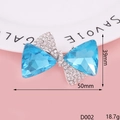 Blue gemstone bow brooch with rhinestones on pink background, size 39mm x 50mm - D002 Triangular Crystal Bowknot (Blue)