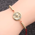Bracelet cordon rouge doré avec pendentif oeil du mal en zircon coloré au poignet - Cordon Rouge Perles Mauvais Œil Style 2