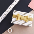 Gift wrapping paper with gold triangle patterns and a matching gold satin ribbon bow - 50x70cm / Simple Gold Triangle Stamping