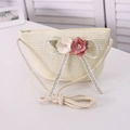 Detail of straw woven crossbody bag featuring floral decor and cotton rope strap - Cream White Bubble Flower
