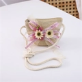 Detail of beige straw crossbody bag featuring pink chiffon ribbon and floral accents - Mesh Flower Style / Beige