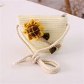 Detailed view of woven straw bag for kids featuring a 3D sunflower and cotton rope strap - Sunflower / Cream