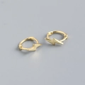 Macro detail of high-polish gold lightning bolt earrings made of S925 sterling silver - Gold