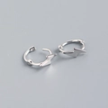Detail shot of silver S925 sterling silver hoop earrings with lightning bolt pendants - White Gold