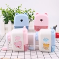 Detail of cute bear-shaped pencil sharpener with hand crank and clear shavings drawer - Mixed Colors