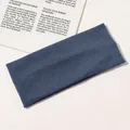 Macro shot of blue ribbed knit headband texture showcasing elastic cotton fabric details - Peacock Blue