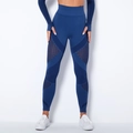 Detail view of seamless knit yoga pants with geometric mesh panels for breathability - Dark Blue