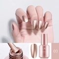 Macro view of 8ml rose gold mirror nail polish with applicator brush and color swatch - 03 Champagne Pink