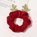 Detail of a Christmas deer antler hair scrunchie in red velvet with gold glitter accents - Red Reindeer Velvet Scrunchie