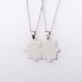 Detail view of silver puzzle piece pendant necklaces with complementary interlocking design - Steel Set (MP107)