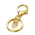 Close-up of shiny gold alloy swivel lobster clasp and 30mm flat key ring assembly - Gold