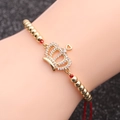 Bracelet ajustable en corde rouge avec perles dorées et breloque couronne en zircons - Corde Rouge Chaîne à Billes Couronne 2