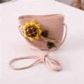 Detail of a pink straw woven bag for girls featuring a yellow sunflower and braided strap - Sunflower / Light Pink