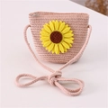 Detail of pink straw crossbody bag with large yellow sunflower and zipper closure - Sun Flower / Light Pink