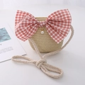 Kids straw crossbody bag featuring a large pink plaid bow and elegant pearl charm detail - Bowknot Style / Beige