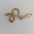 Detailed close-up of golden snake hairpin with black cross patterns on white background - No Rhinestone / Antique Gold