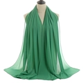 Detailed view of emerald green pearl chiffon shawl with delicate hem and drape texture - Emerald Green