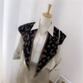 Knitted double-sided shawl scarf with brown leopard print pattern on mannequin - Knitted Pointed Leopard Brown
