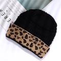 Macro detail of acrylic beanie with black knit texture and leopard print fold-up cuff - One Size / Black