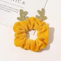 Detail of yellow velvet Christmas scrunchie with golden glitter reindeer antlers on white background - Yellow Reindeer Velvet Scrunchie