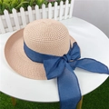 Beige straw sun hat with a large navy blue ribbon bow and wide brim for beach vacations - Adjustable M (56-58cm) / Light Pink