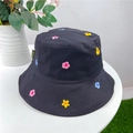Black cotton bucket hat featuring colorful floral embroidery and decorative side tag - M (56-58cm) / Black