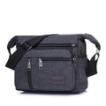 Dark grey canvas crossbody bag with multiple zippers and adjustable shoulder strap - Black